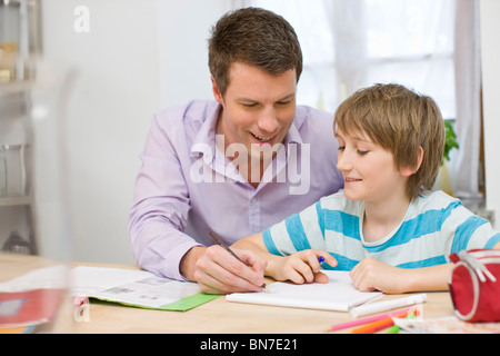 Father and son doing homework Stock Photo