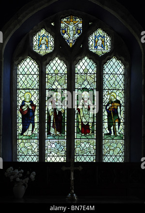 A stained glass window depicting Jesus, the Blessed Virgin Mary and St John the Baptist, St Juliot Church. The window is by James Powell & Sons Stock Photo