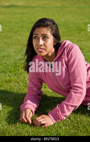 California United States meditating pondering 15-17 year old Hispanic American girl.thoughtful dreaming thinking sitting front view MR  © Myrleen Pearson Stock Photo