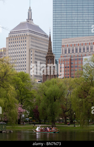 Boston's Public Garden Swan Boat with both Hancock Towers and Unitarian Church in background. Stock Photo