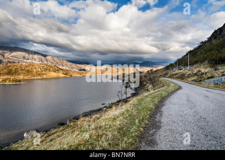 Loch stack, Sutherland in the north of Scotland along the A838 with evening sun on mountains Stock Photo