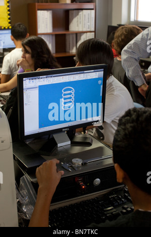 High school girls and boys work on computers with flat-screen monitors in freshman engineering class Stock Photo