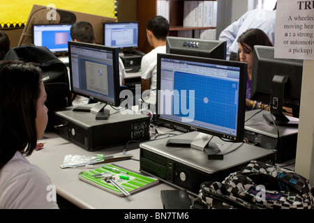 High school girls and boys work on computers with flat-screen monitors in freshman engineering class Stock Photo