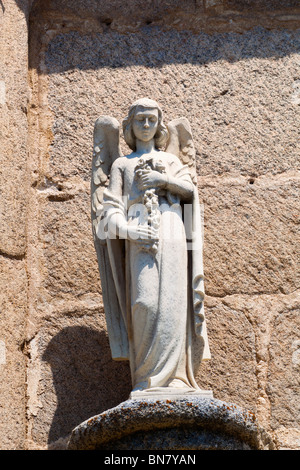 Avila, Avila Province, Spain. Statue of angel on wall of 15th century Convent of the Encarnación, Stock Photo