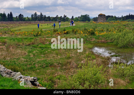 Tourists visiting the moor with its memorial cairn at the Culloden battlefield, Scotland, UK Stock Photo