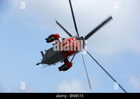 Royal Navy Rescue Westland Sea King HU5 helicopter XZ920 flying in the UK Stock Photo