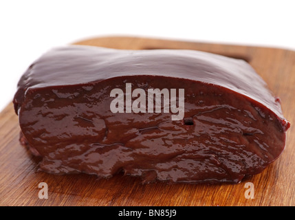 Veal liver part on wood board Stock Photo