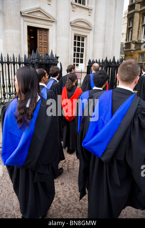 Graduates in graduation gowns / robes at a graduate /graduating ceremony at Cambridge University. Cambridge. UK. Stock Photo