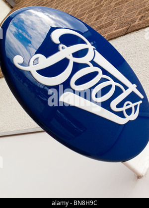 Boots the Chemist sign outside a shop in a UK high street Stock Photo