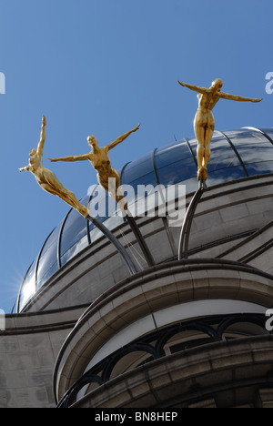 Statues of nude women on top of building on Lombard Street in the city