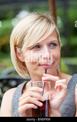 Young woman 30s with soft drink Stock Photo