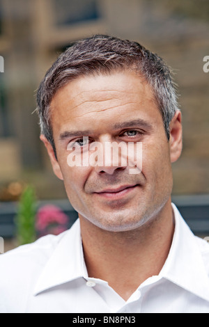 Man smiling outdoors Stock Photo