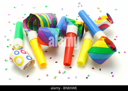 Multicolor party blowers isolated on white background Stock Photo - Alamy