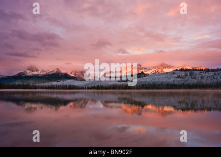 Sawtooth mountains sunrise reflection in little red fish lake, Idaho Stock Photo