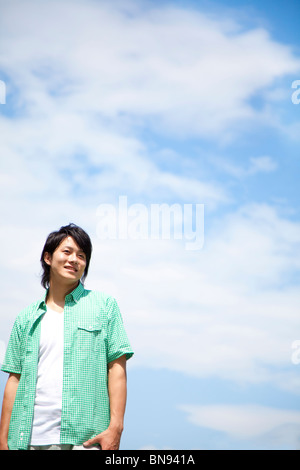 Man standing and smiling Stock Photo