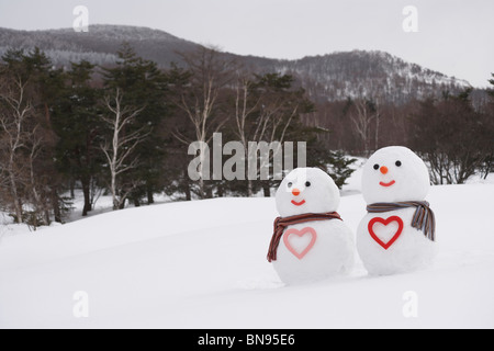 Snowman couple with heart shape, Yamagata Prefecture, Japan. Stock Photo
