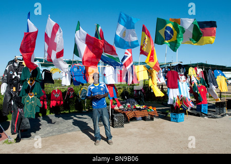 Vendor in front of his kiosk with Wold Cup 2010 Utensils in Langebaan Western Cape South Africa Stock Photo