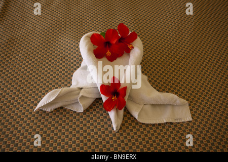 love heart shaped towel on bed. Stock Photo