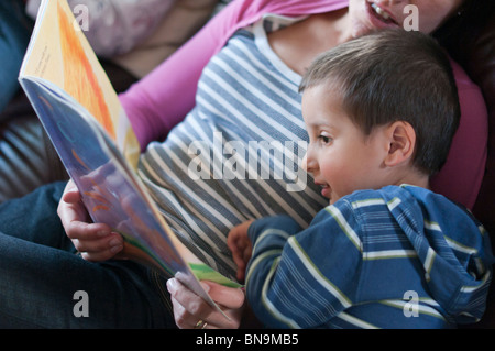 Mother reading bedtime stories to child Stock Photo