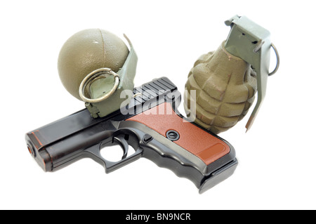 A plastic pistol and two metal green hand grenades isolated on white Stock Photo