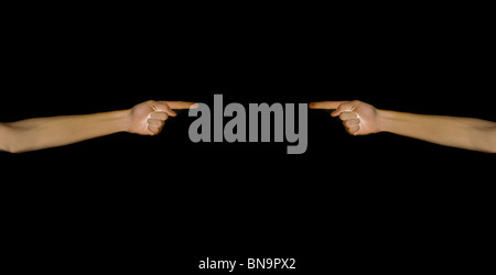 Two hands pointing isolated on black. Stock Photo