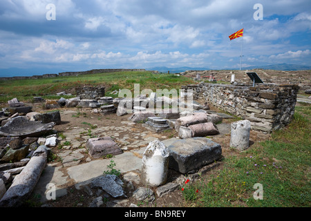 The flag of the Republic of Macedonia flying over the ruins of the ancient city of Stobi. Stock Photo