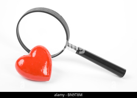 Red Heart and magnifier, concept of searching love, Healthy Life Stock Photo