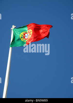 A Portuguese Flag Flying in the Wind Stock Photo