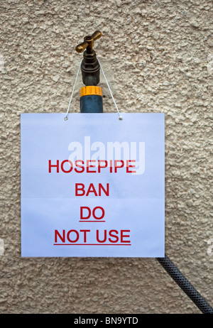 Hosepipe ban sign with notice forbidding the use of garden water hose on tap during drought UK Europe