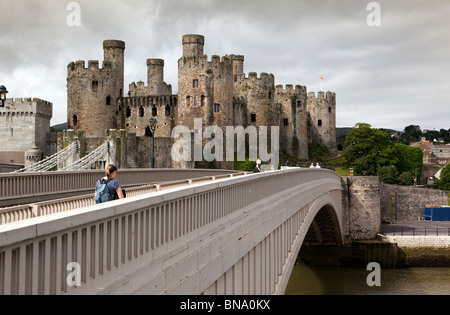 UK, Wales, Gwynedd, Conway Castle, with Telford’s suspension bridge and A55 road bridge Stock Photo