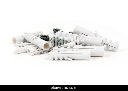 Heap of a plastic dowels on white background Stock Photo