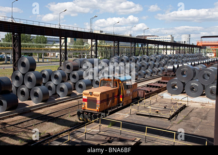 ArcelorMittal: production of steel coils; store of complete steel coils ready for shipping by freight train Stock Photo