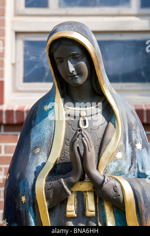 Statue of Our Lady of Guadalupe in front of the St. Jane de Chantal Catholic Church in Abita Springs, Louisiana Stock Photo