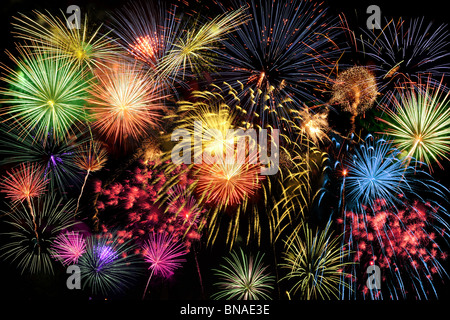 Fireworks of different colors brighten the night sky Stock Photo