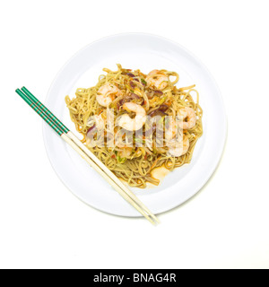 Prawn Stir fry on white plate isolated against white background. Stock Photo