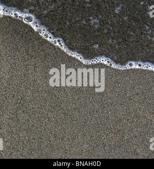 Wave on sand Stock Photo
