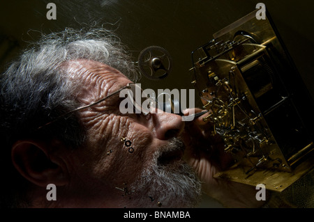 A horologist repairing an old carriage clock at The Museum for Islamic Art in west Jerusalem Israel Stock Photo