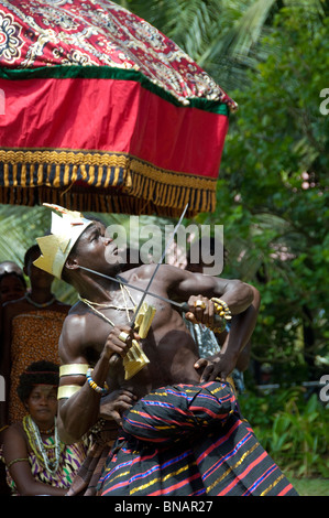 Africa, Ghana, Accra. La Palm Beach Hotel. Traditional West African folkloric show. Ceremonial dancer with knife. Stock Photo