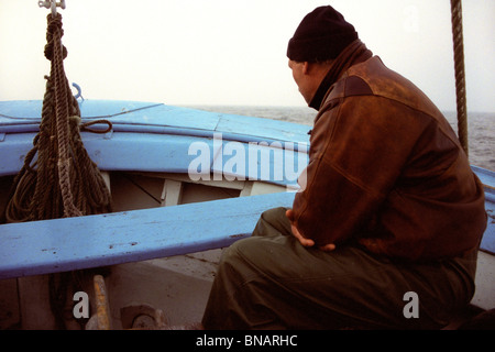 Fisherman in his boat Stock Photo