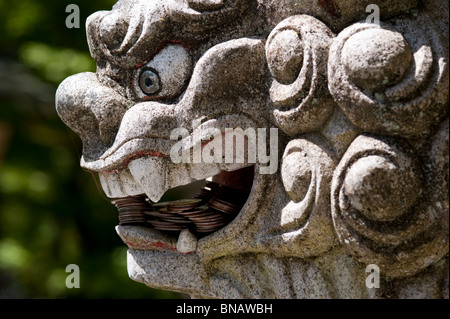 Shinto Shrine Guard Lion Dog sculpture protecting the Shrine entrance Granite Falls Washington State USA Stock Photo