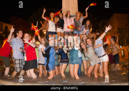 Spanish fans celebrate Spain's win over Germany in the FIFI World Cup semi finals. Passeig del Borne, Palma, Mallorca, Spain. Stock Photo