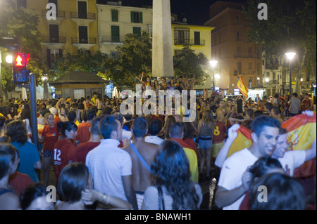 Spanish fans celebrate Spain's win over Germany in the FIFI World Cup semi finals. Passeig del Borne, Palma, Mallorca, Spain. Stock Photo