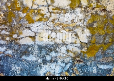 The old concrete wall with stains and cracks Stock Photo