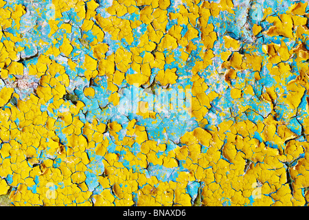 The surface of the cracked paint blue and yellow Stock Photo