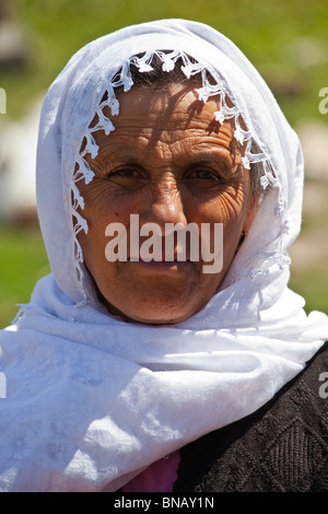 A Kurdish woman in traditional dress in the parade of the first Kurdish ...