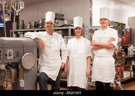 Chefs in commercial kitchen, portrait Stock Photo
