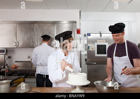 Making cake in commercial kitchen Stock Photo
