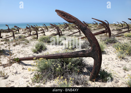 Anchors on the beach Praia do Barril in Tavira, Algarve Portugal Stock Photo