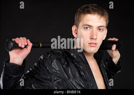 Young man with baseball-bat. Stock Photo