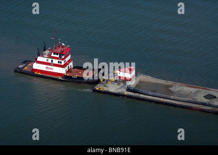 aerial view above Manson Construction tug boat pushing barge San Francisco bay California Stock Photo